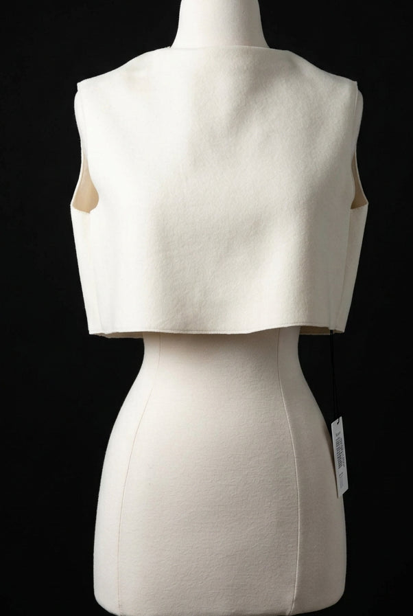An off-white cropped  top. can be worn front to back or back to front.